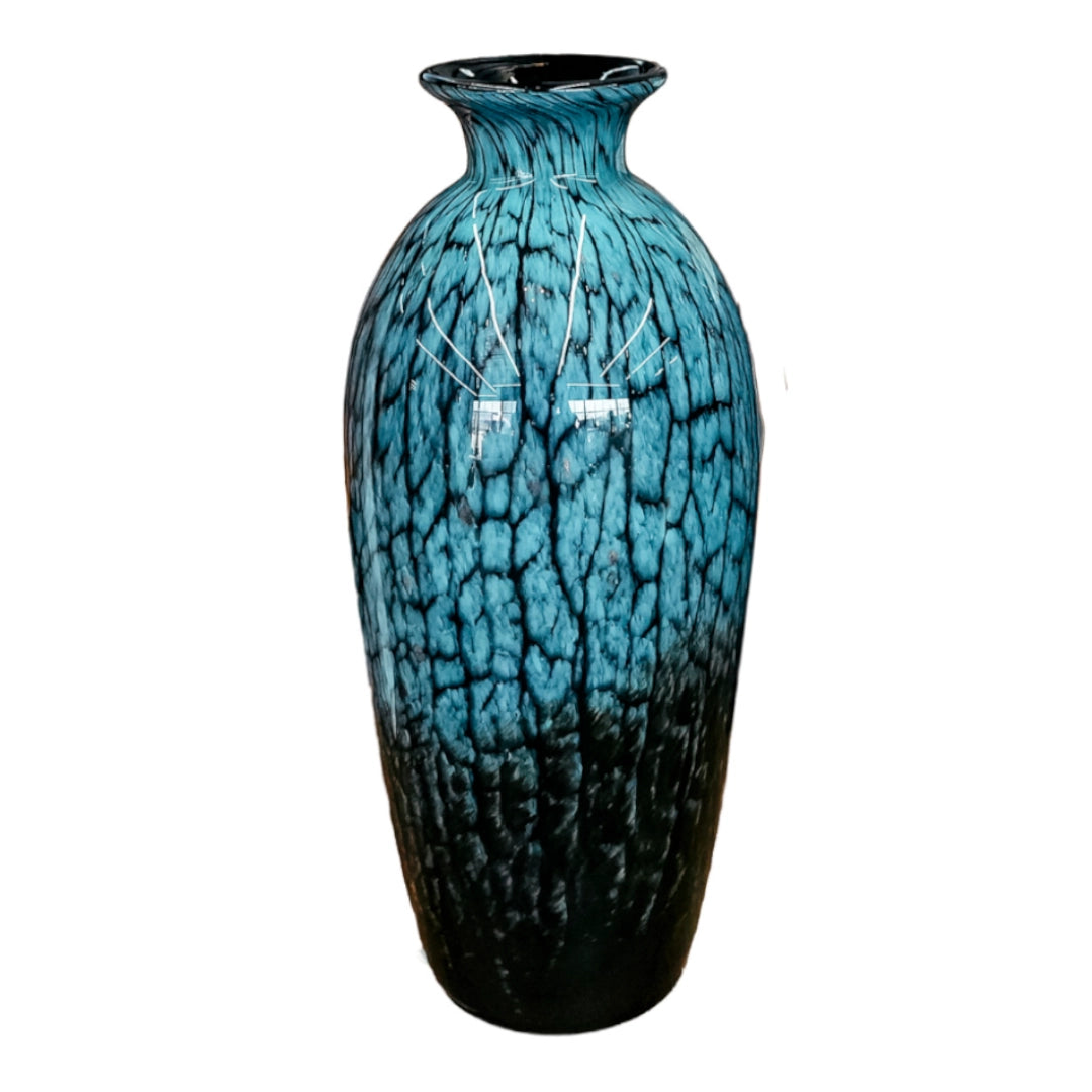 Blue ceramic vase with a textured surface on a white background