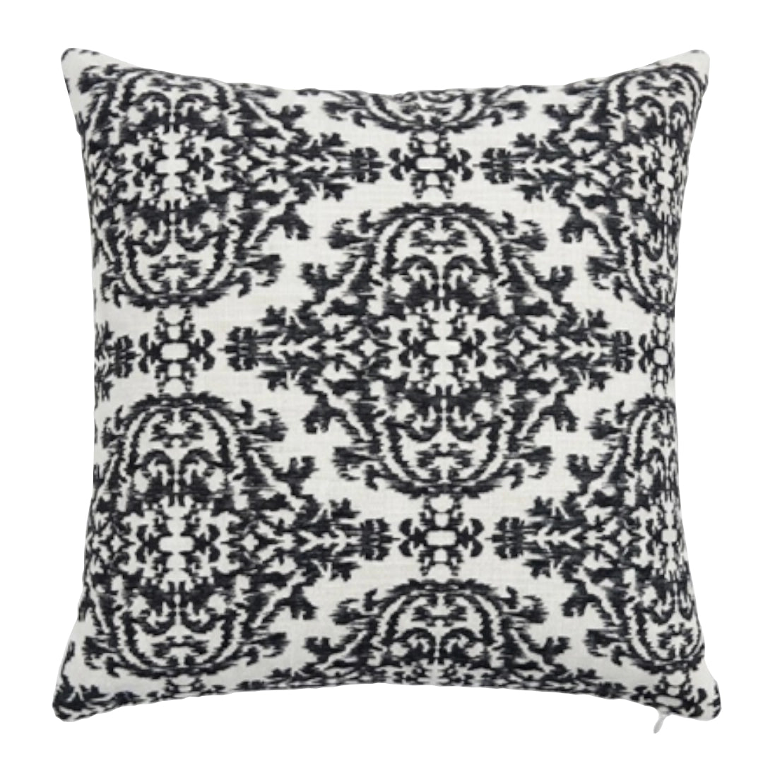 Decorative pillow with black paisley pattern on a white background