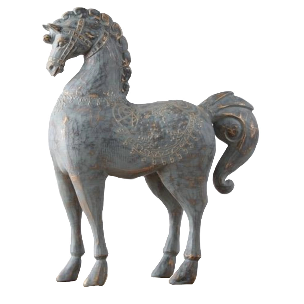 Decorative horse statue with intricate designs on a white background