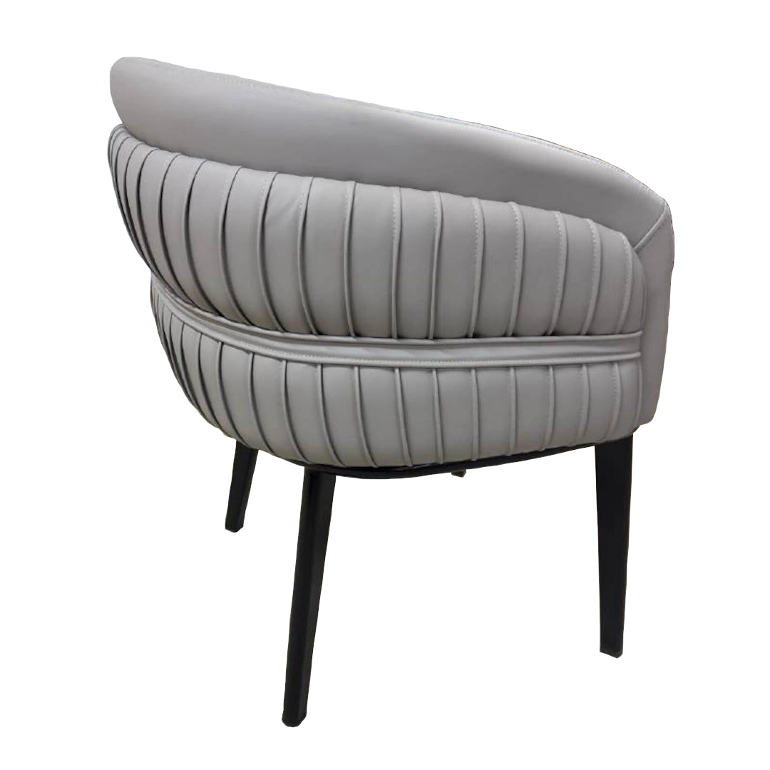 Gray upholstered chair with black legs on a white background