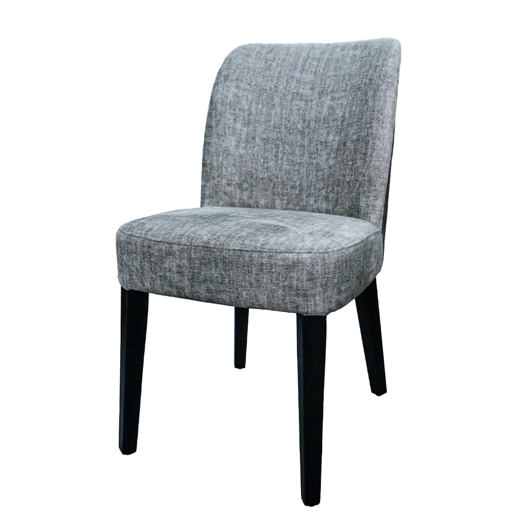 Gray upholstered chair with black legs on a white background