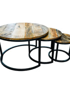 Set of three wooden nesting tables with metal legs on a white background