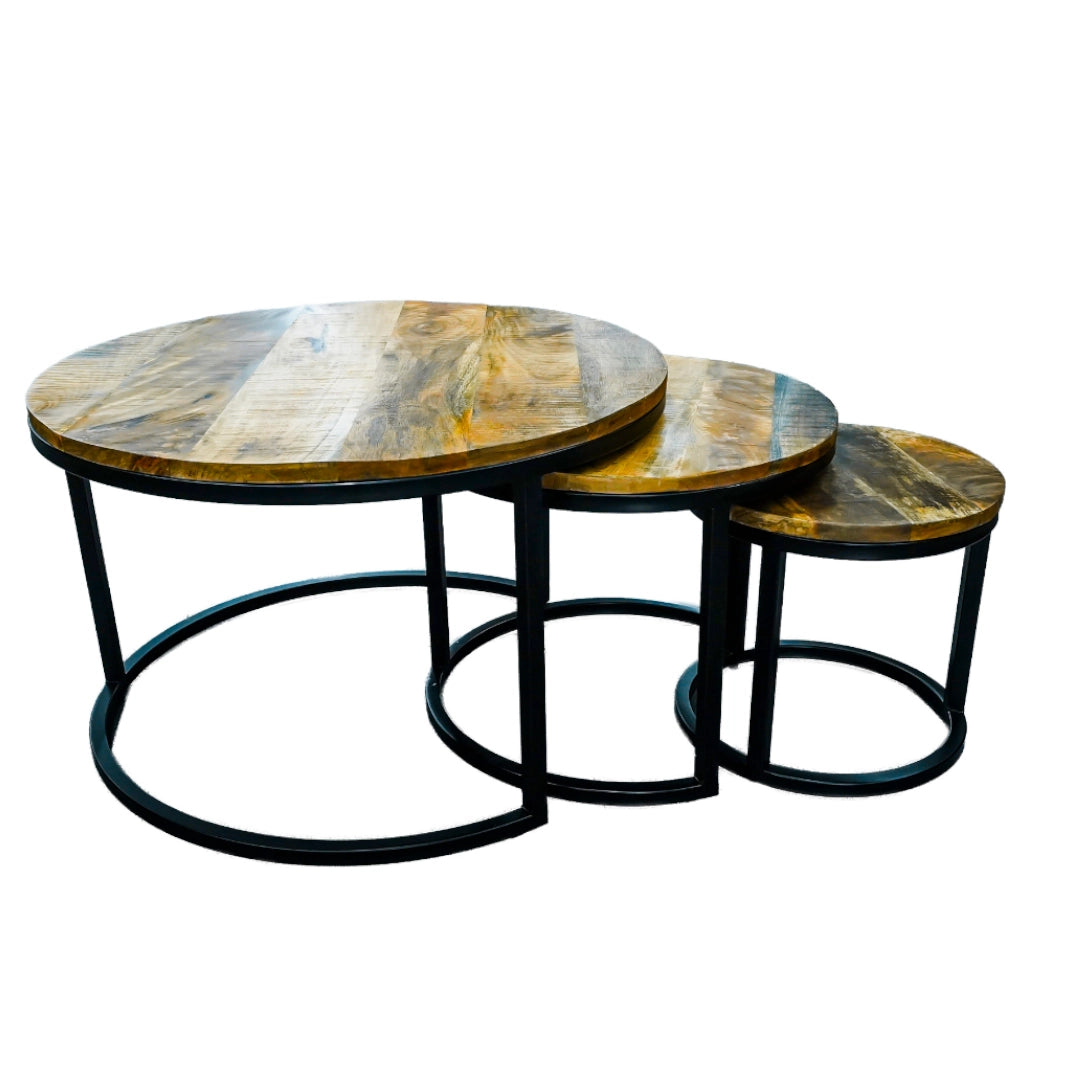 Set of three round wooden tables with metal bases on a white background