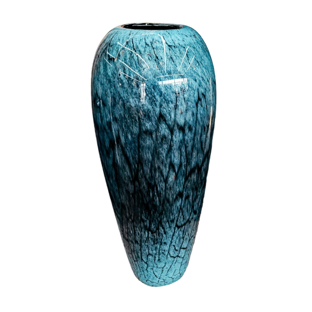 Tall blue and black patterned vase on a white background
