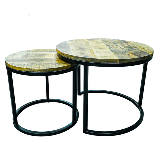 Two round wooden tables with metal legs on a white background