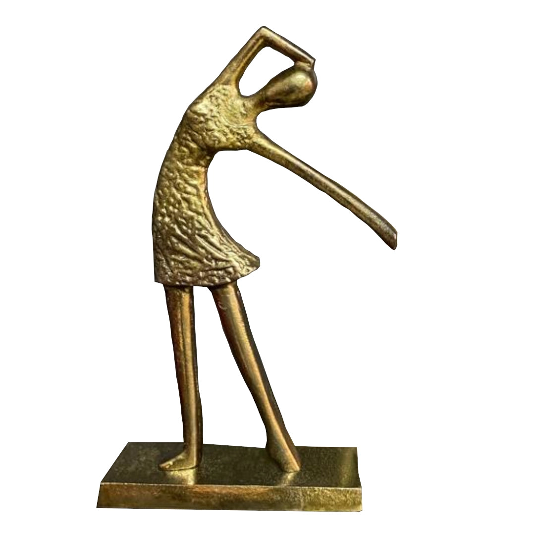 Statue of a figure in an outstretched arm  dance pose on a white background.