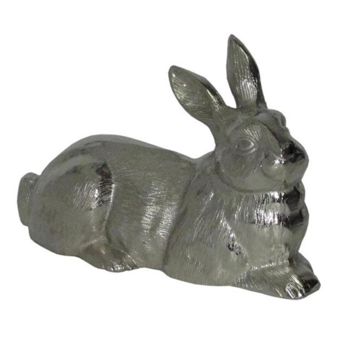 AN Aluminium rabbit figurine on a white background