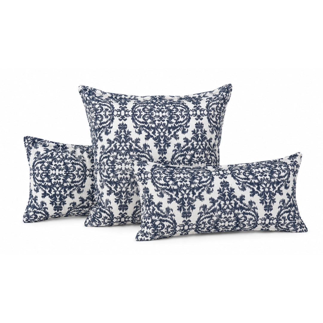 Set of three decorative pillows with blue and white pattern on a white background