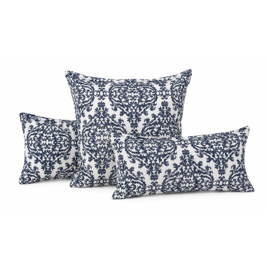 Set of three decorative pillows with blue and white pattern on a white background