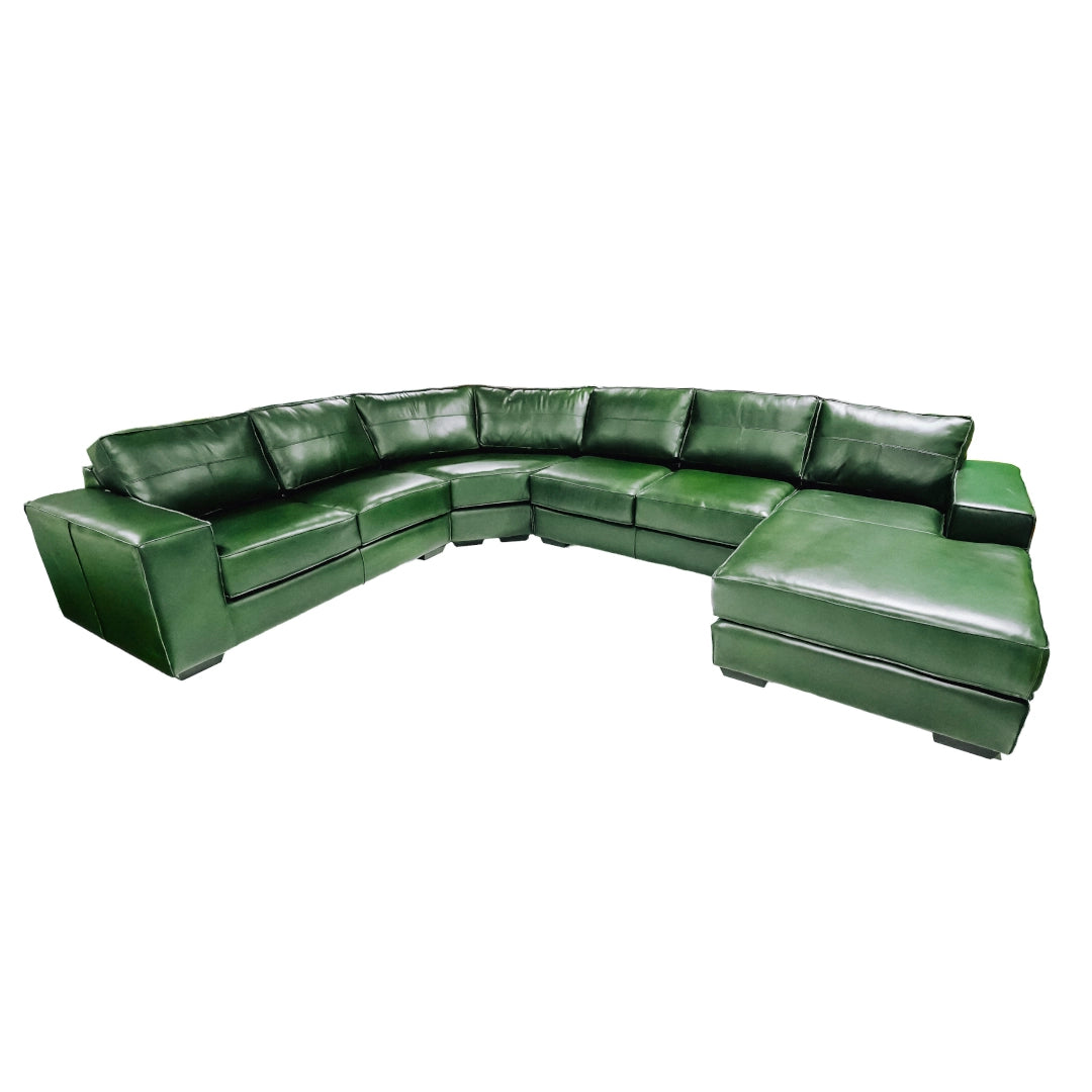 Green leather sectional sofa on a white background