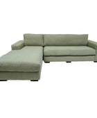 Green sectional sofa on a white background