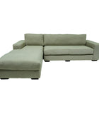 Green sectional sofa on a white background