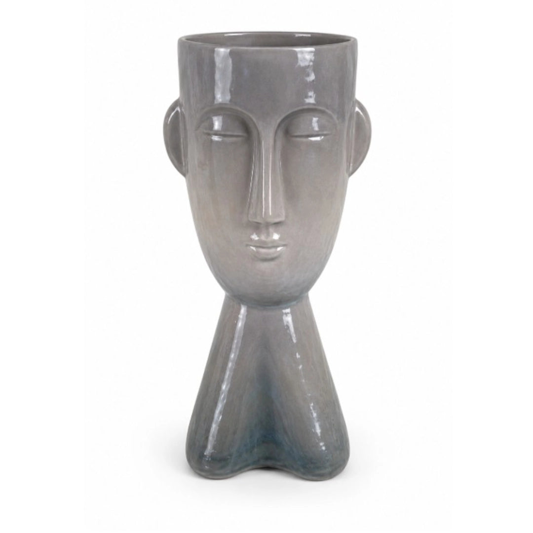 A face shaped vase on a white background