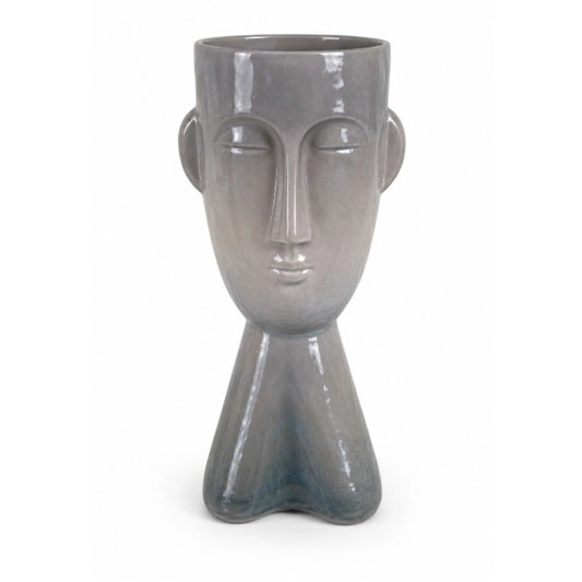 A face shaped vase on a white background