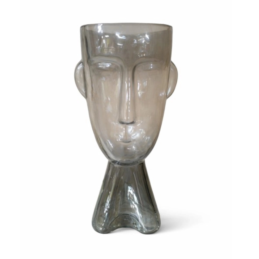 A face shaped vase on a white background