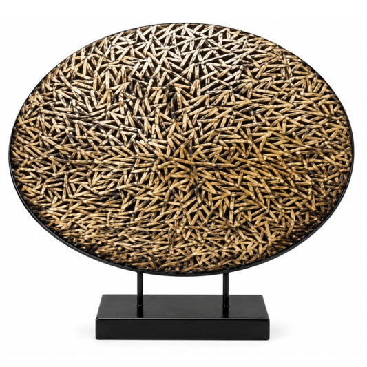 An oval decorative tray or wall art piece with a dense pattern of small natural wood dowels, mounted on a black rectangular stand against a plain white background.