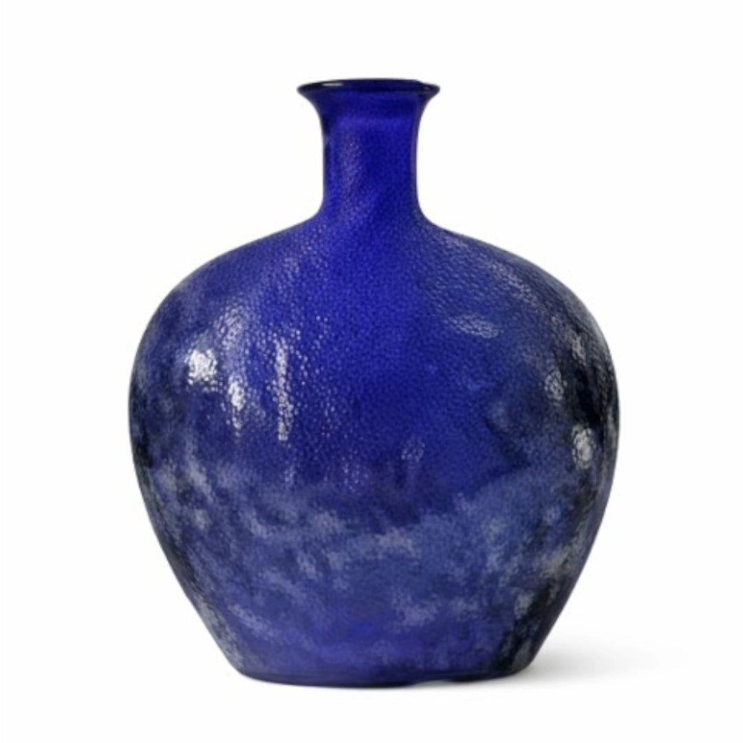 A cobalt blue textured glass vase with a short neck and rounded body, shown on a plain white background.