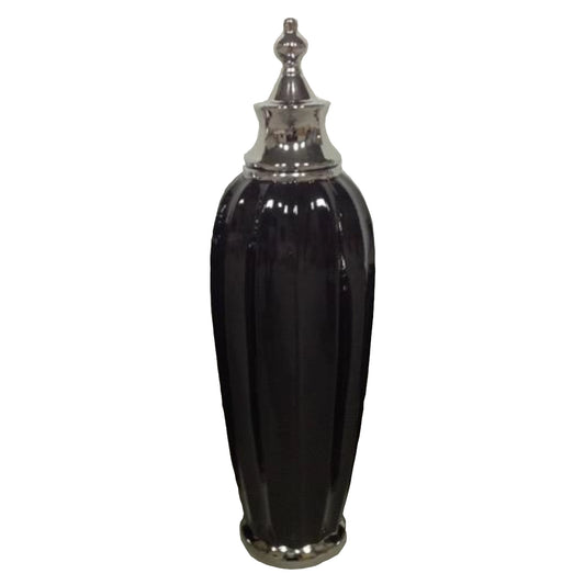 A Large black jar with a silver top on a white background.