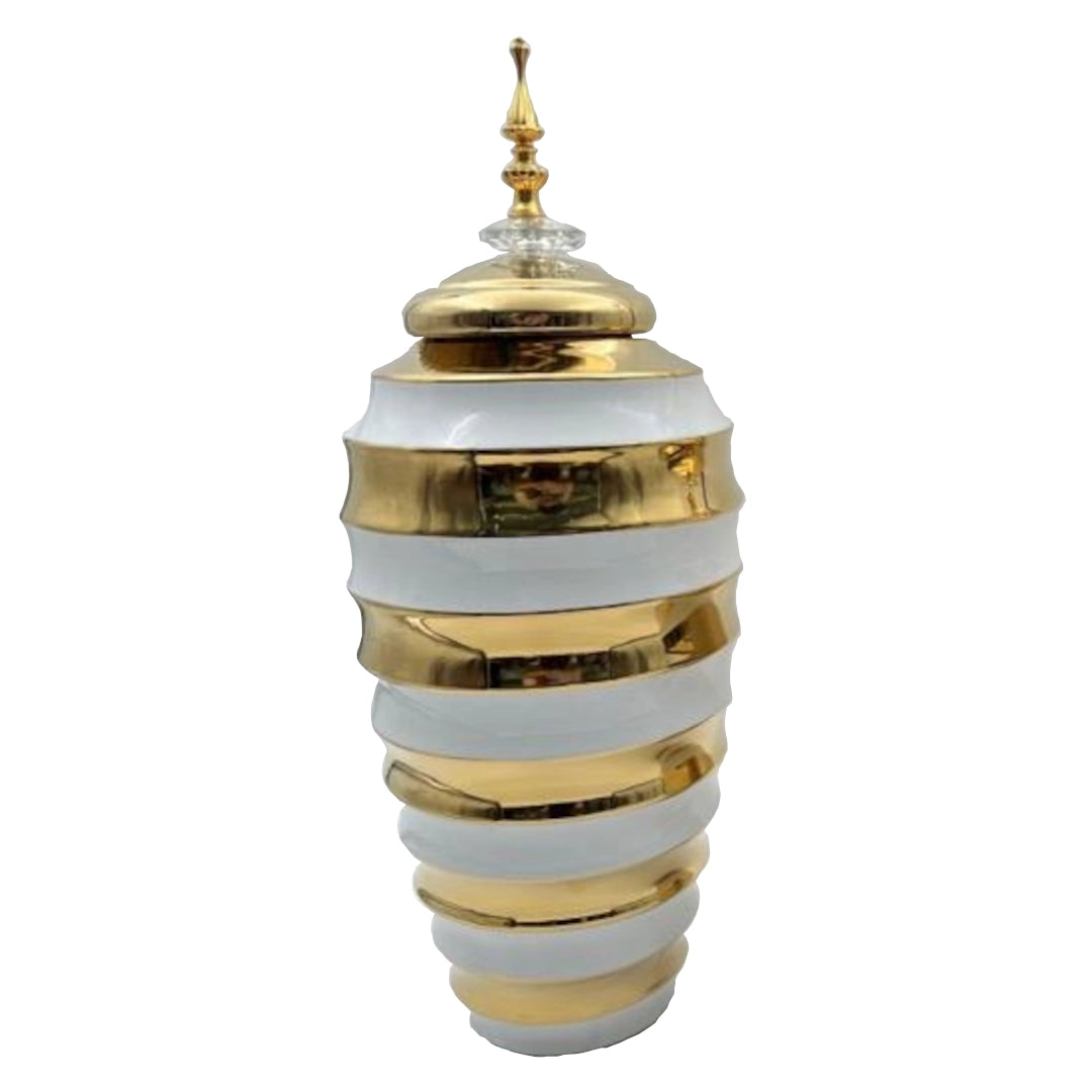 Decorative Jar with gold and white striped design on a white background