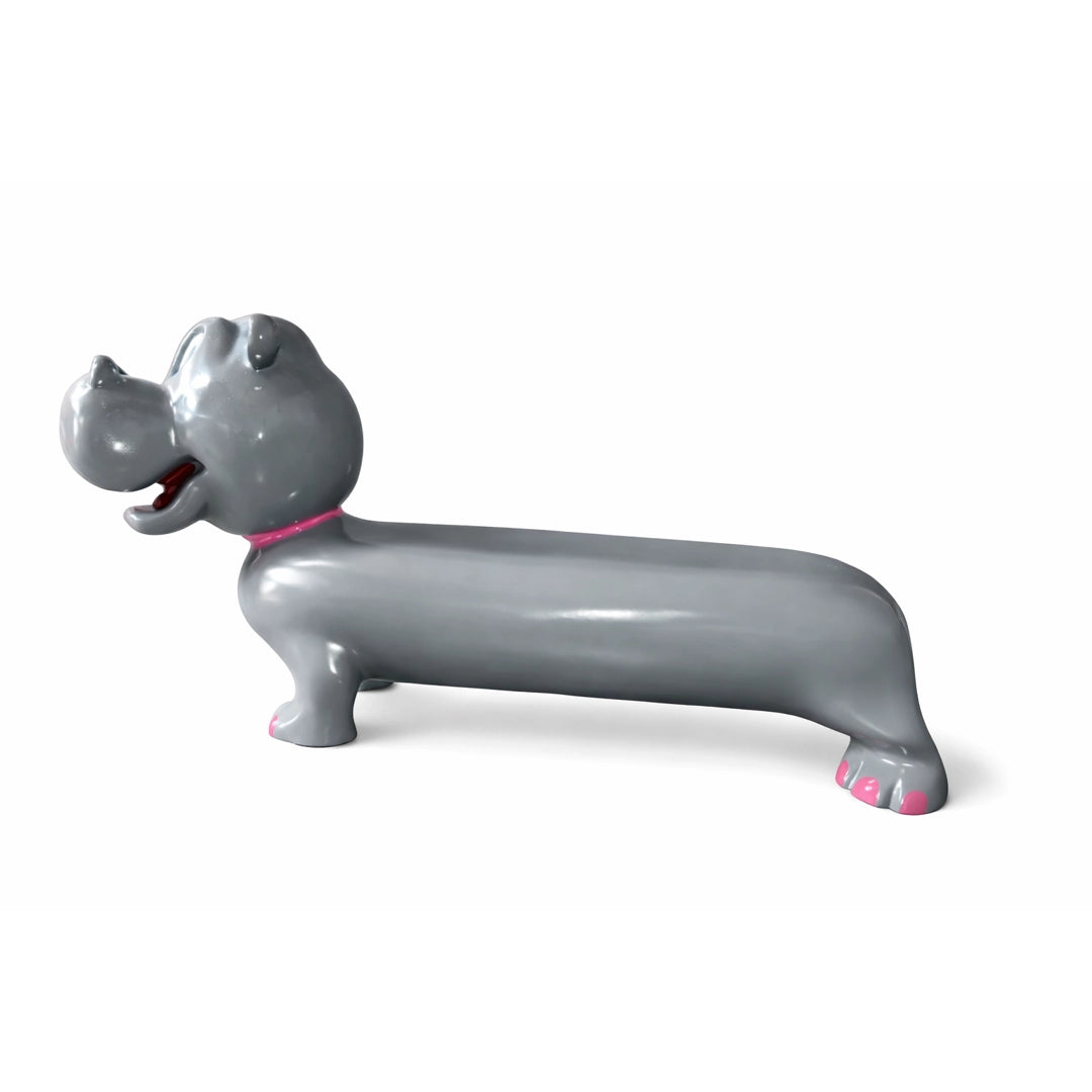A gray hippo-shaped bench with a glossy finish, featuring pink accents on its collar and feet, set against a plain white background.