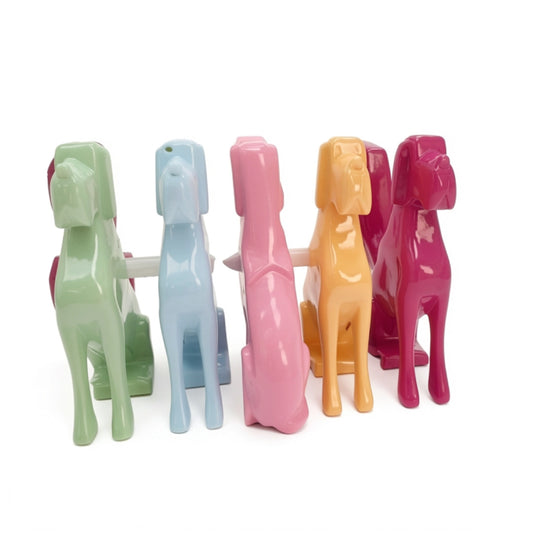 A collection of brightly coloured dog statues on a white background