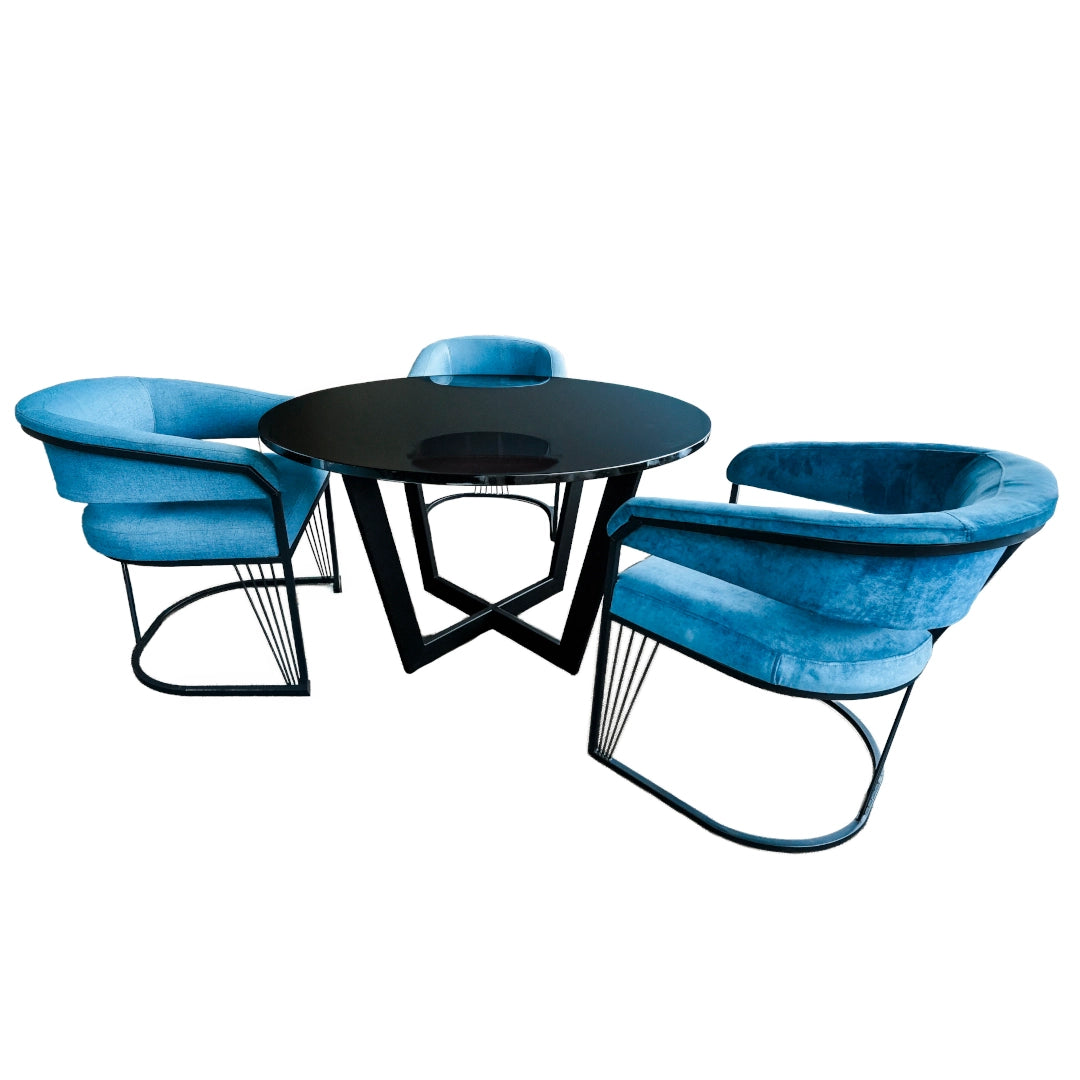 A dining table with blue dining chairs on a white background