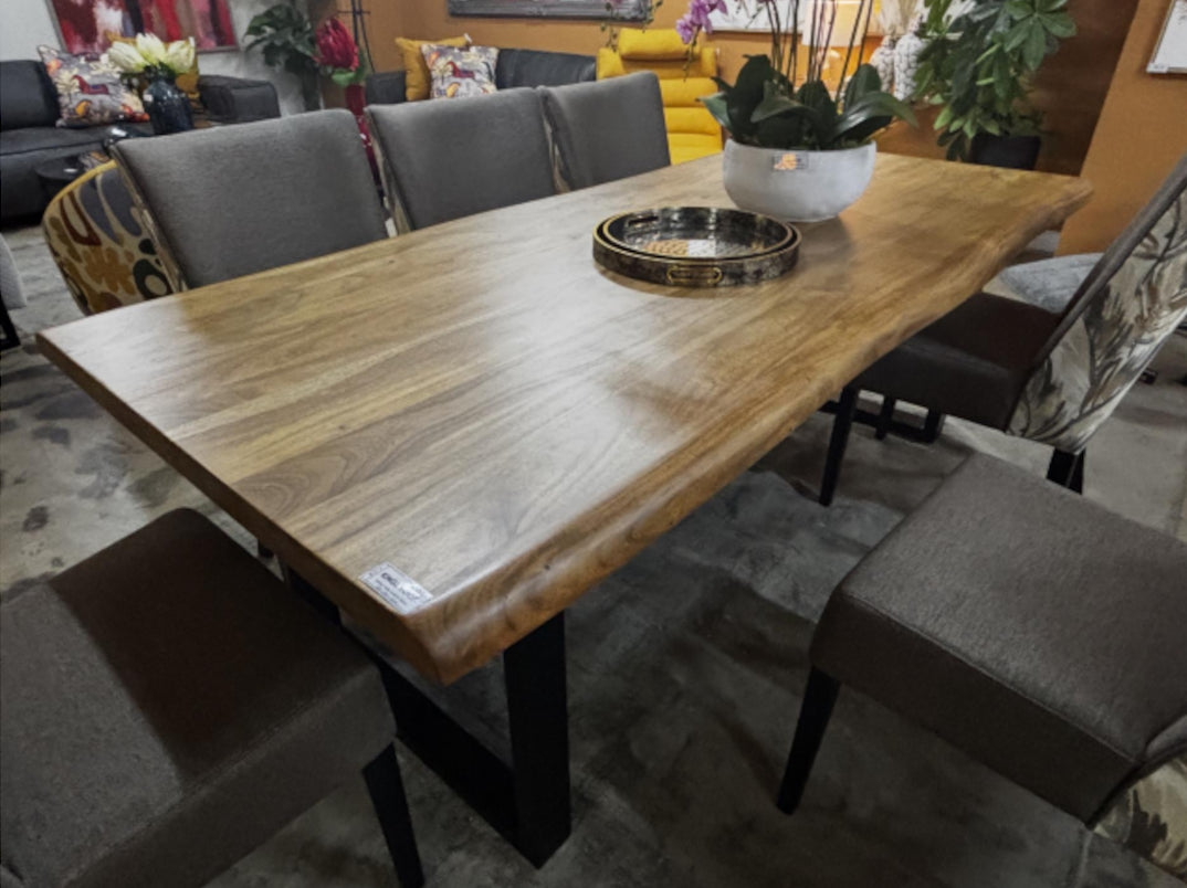 Dining table with chairs in a room setting