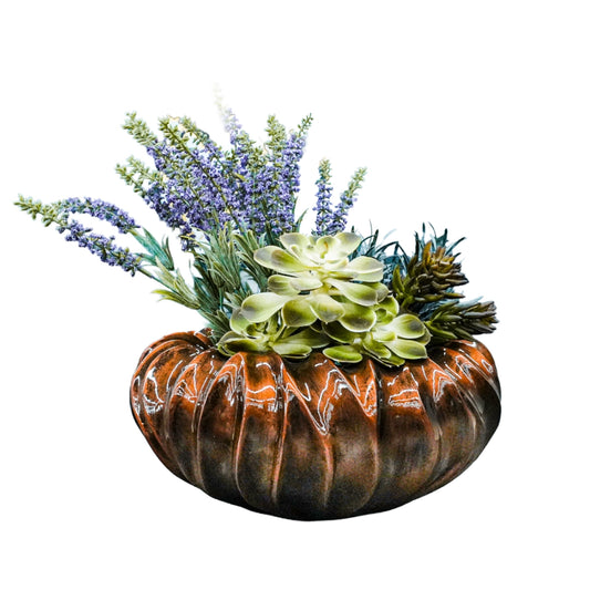 Decorative planter with succulents and lavender on a white background