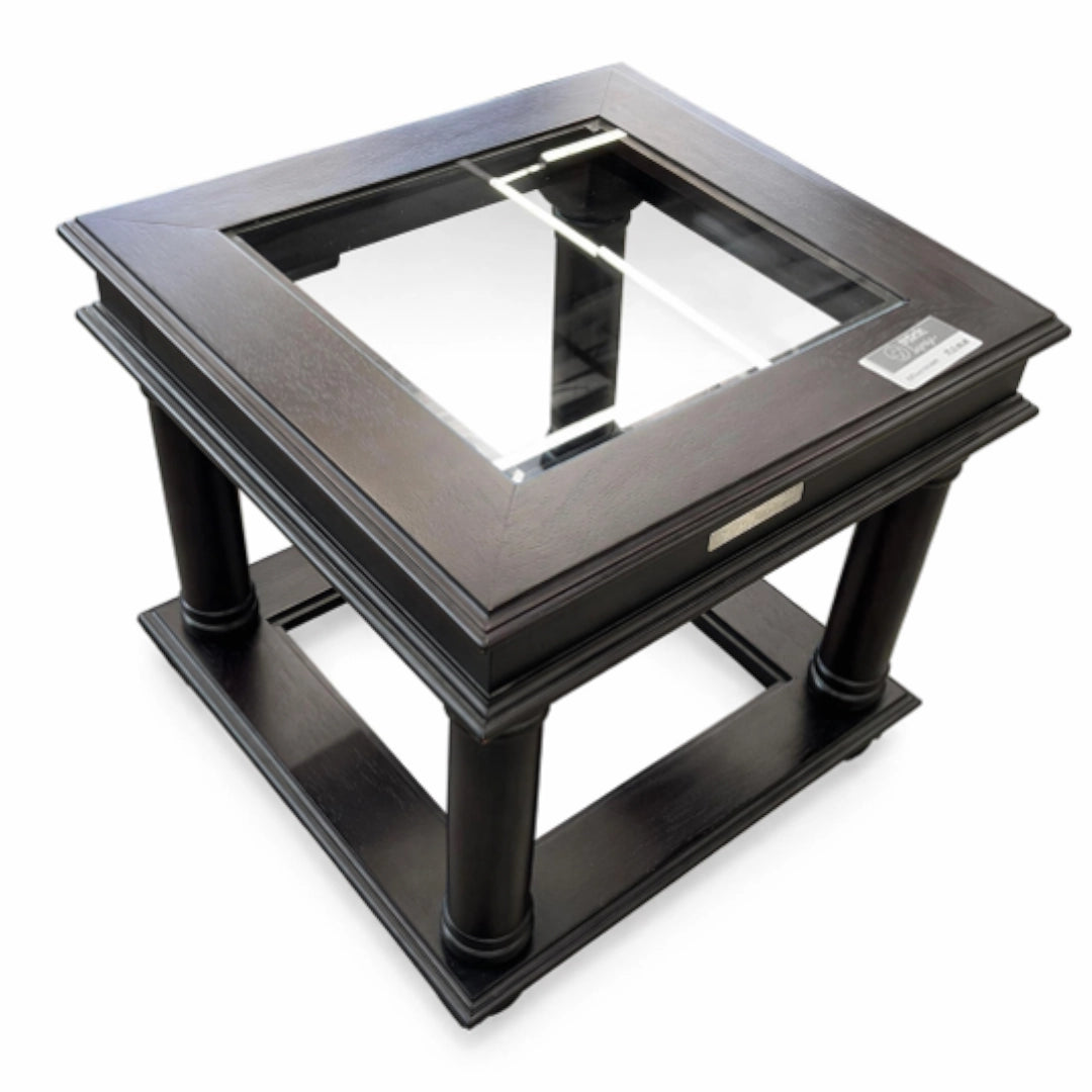 A Wood and glass side table on a white background