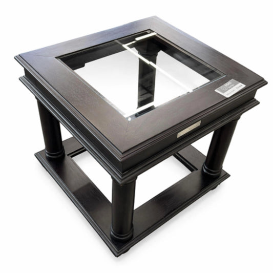 A Wood and glass side table on a white background