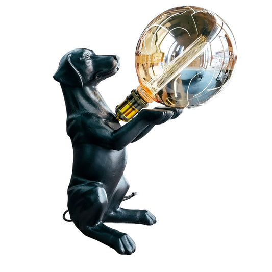 Dog-shaped lamp holding a large light bulb on a white background