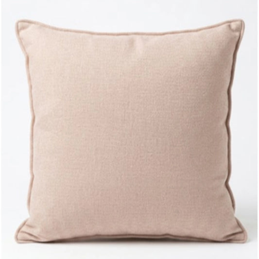 A pink scatter cushion on a white background