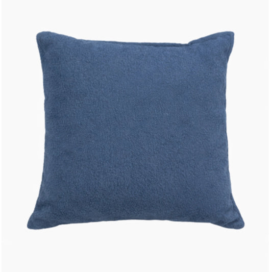 A blue scatter cushion on a white background