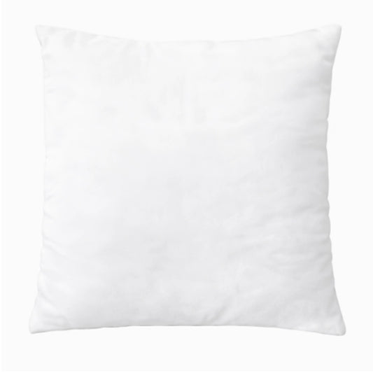 A white scatter cushion on a white background