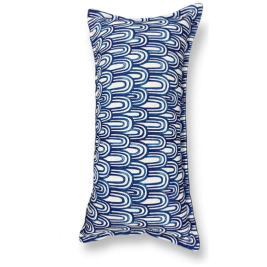 A blue scatter cushion on a white background