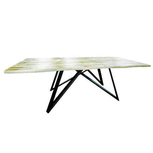 Modern dining table with a white marble top and black metal legs on a white background
