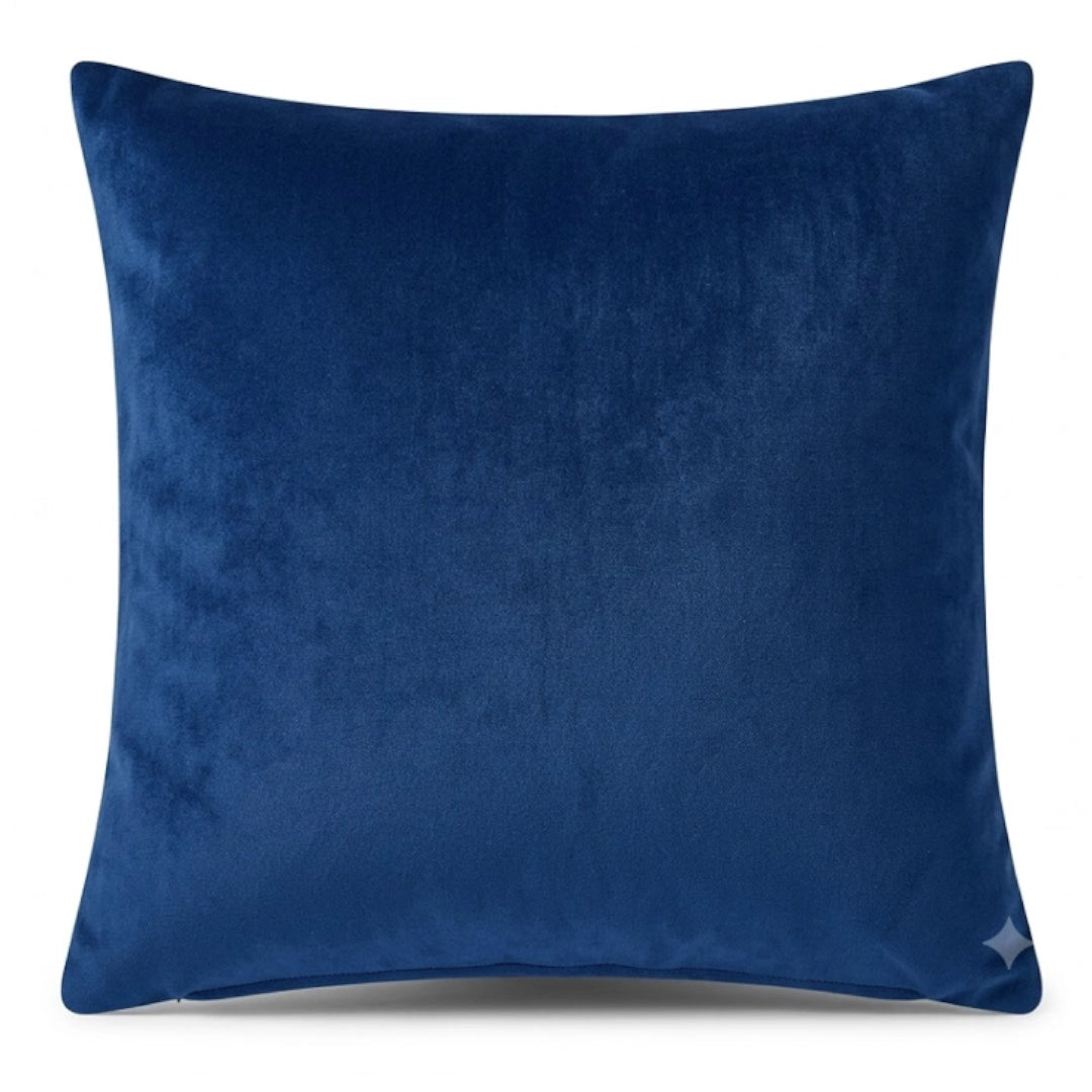 A blue scatter cushion on a white background
