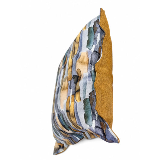 A multi-colour patterned scatter cushion on a white background