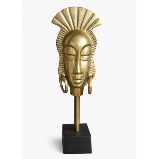 A face sculpture with a black stand on a white background