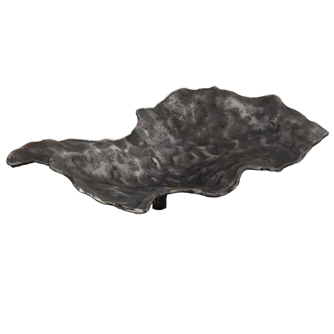 Decorative leaf-shaped tray with a textured surface on a white background
