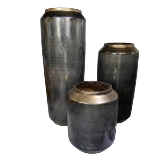 A set of metallic pots on a white background