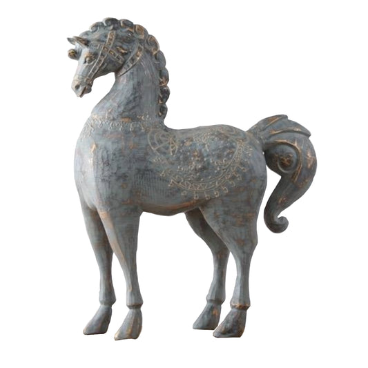 Decorative horse statue with intricate designs on a white background