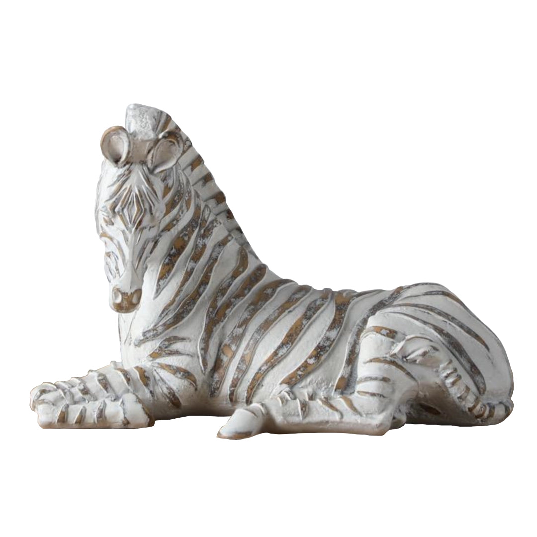 Decorative zebra figurine with a white and brown striped pattern on a white background