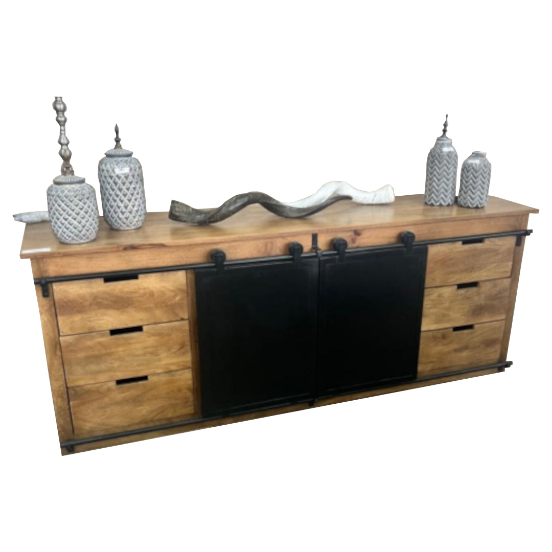 Wooden sideboard with sliding black panel and decorative items on a white background