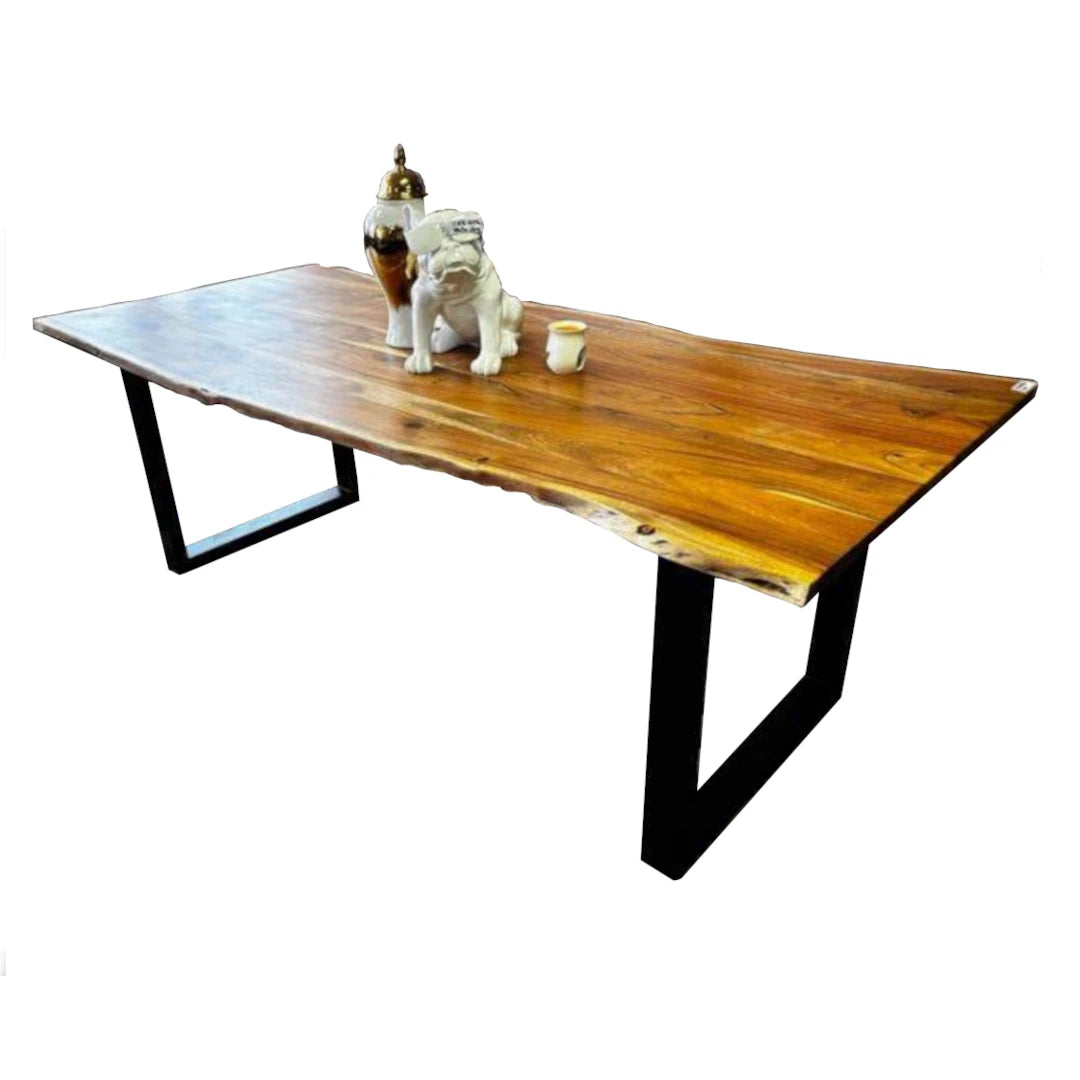 Wooden dining table with black metal legs on a white background
