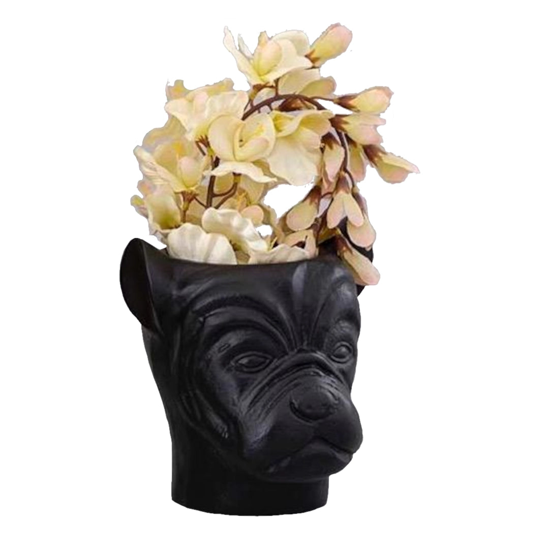 Black dog-shaped vase with flowers on a white background