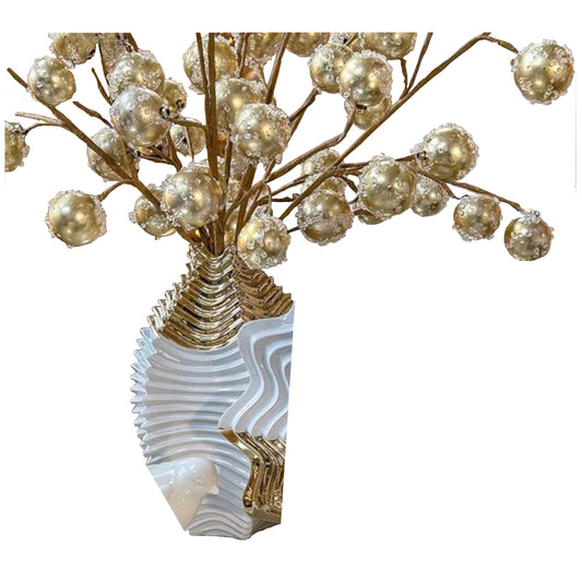 Decorative Shell vase with gold branches and pearls on a white background