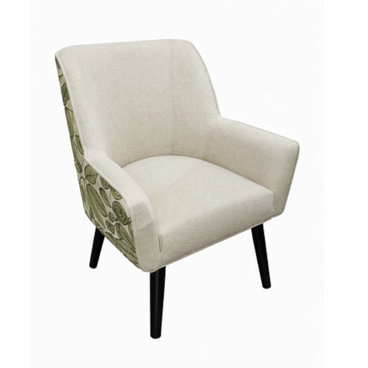 A dining chair with a leaf patterned back and dark legs on a white background