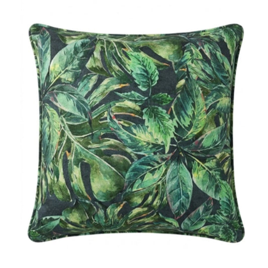 A square throw pillow featuring a dense tropical leaf pattern in shades of green on a dark background, isolated on a white studio background.
