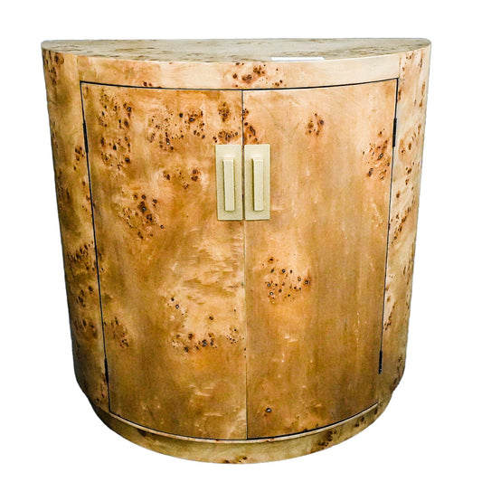 Wooden sideboard with a natural finish and gold handles on a white background